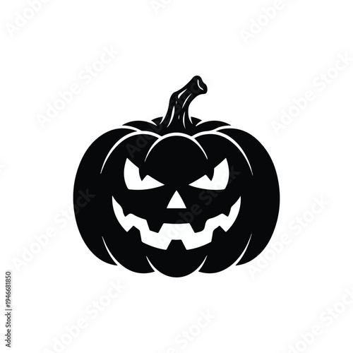 Spooky black silhouette of a carved jack o lantern face glowing eerily in the dark night