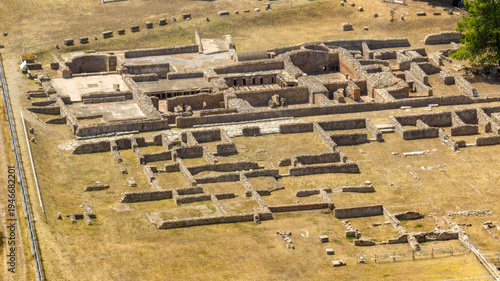Photos Aerial perspective of an Ancient Roman city, in an archaeological site featuring stone foundation ruins