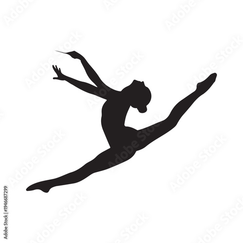 Silhouette of graceful female dancer performing a difficult leap with pointed toes and extended limbs