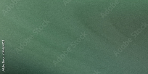 A close-up view of a textured green wall with subtle variations in color and depth