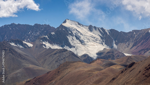 Scenic landscape view of snowcapped mountain peak in Muzkol range along Pamir Highway, Murghab, Gorno-Badakhshan, Tajikistan