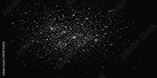 Abstract water rain drops on a black window texture create a dark night sky pattern with falling white snow and glowing stardust like a winter galaxy wallpaper