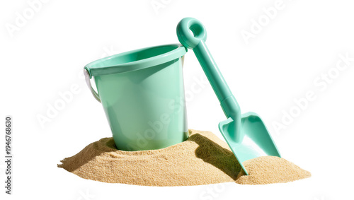 Isolated plastic beach bucket and shovel toy on sand for children's summer playtime