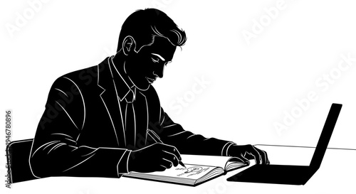 Businessman writing in notebook at desk with laptop, focused on work