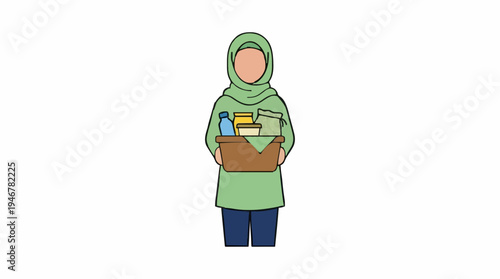 A person wearing a green hijab and tunic holding a box filled with groceries and household items against a white background.