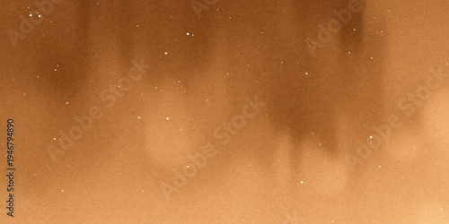 A macro texture of golden liquid bubbles and rain drops on an aged vintage surface with a grunge brown pattern