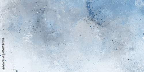 A clean liquid splash of blue water drops creates a frozen winter frost pattern on the grunge window surface for a cold nature wallpaper backdrop