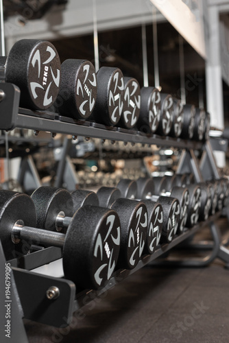 Gym equipment weights and various exercise tools, creating environment for effective workouts and strength training. Modern and clean gym interior with sport and fitness equipment, fitness center inte