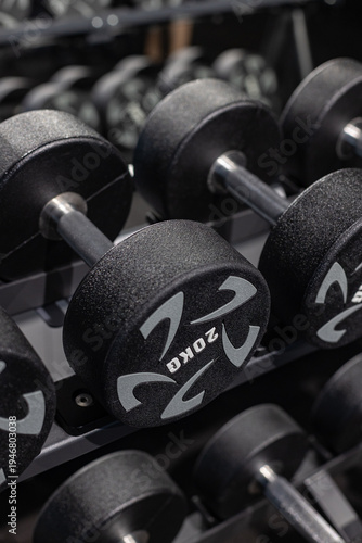 Gym equipment weights and various exercise tools, creating environment for effective workouts and strength training. Modern and clean gym interior with sport and fitness equipment, fitness center inte