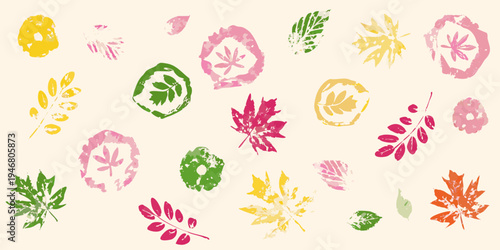 Colorful stamped leaves create a playful autumn patterned background