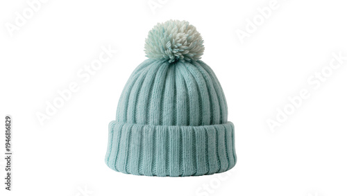 Photos Isolated knitted light blue beanie hat with pom pom, cozy winter fashion accesso