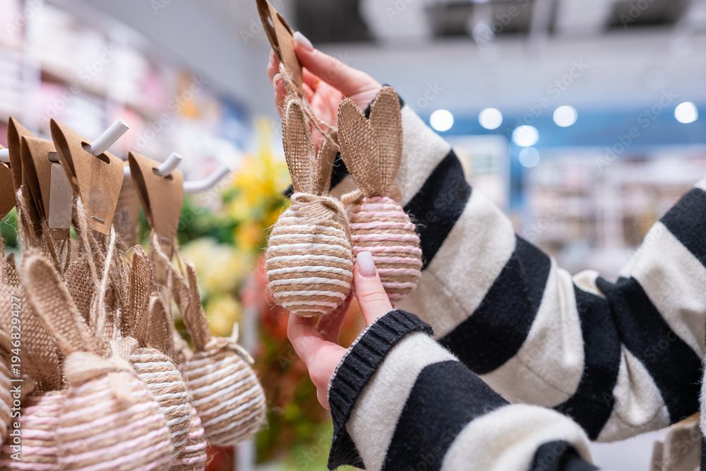 Fototapeta premium Woman Looking At Decorative Eggs For Easter
