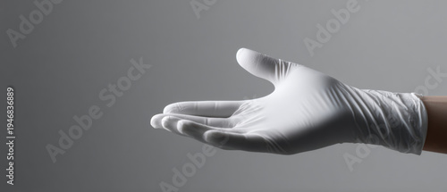Hand Wearing White Medical Glove Extended