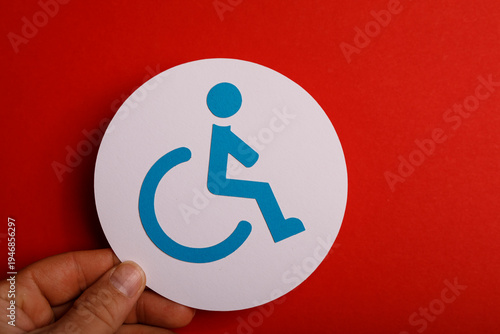 Hand holding a disability s...