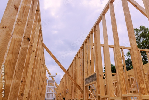 Construction site showing wooden beams framing for new building