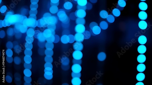 Fotografie Glowing blue LED lights forming an abstract pattern against a dark, bokeh-filled background