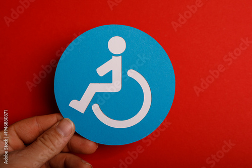 Hand holding a blue accessi...