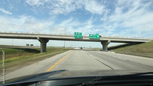 Manitoba bridges with signs for Winnipeg and Steinback. HD.