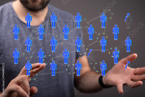 Concept of digital networking and teamwork. A man holding a connected network of people. Communication and business con