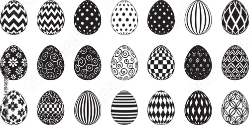 A collection of black and white Easter eggs displays various intricate patterns. The eggs are arranged in a grid format, showcasing diverse designs including zigzags