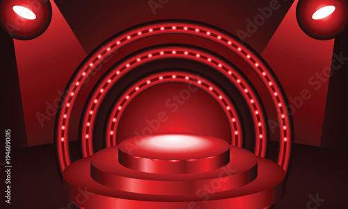 Red stage with illuminated arch and spotlight