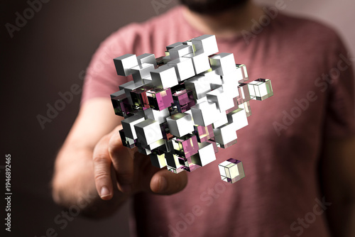 Person touching a 3D cube m...