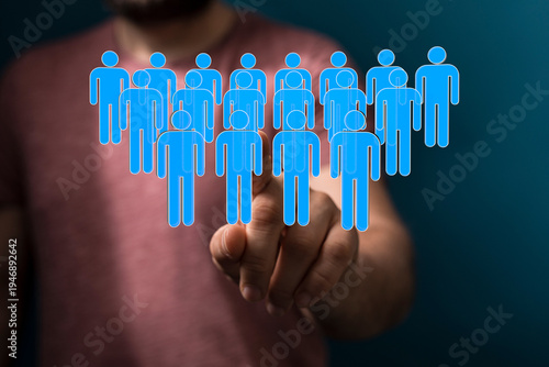 Hand pointing at a group of...