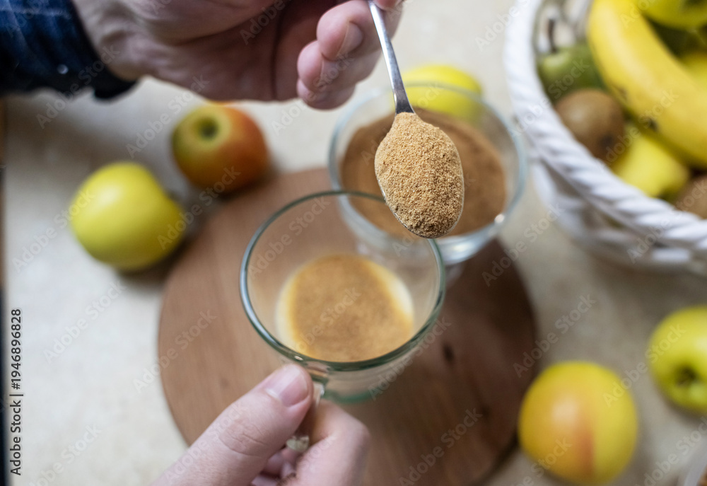 custom made wallpaper toronto digitalPerson adding apple fiber powder to a glass of yogurt, surrounded by fresh apples and walnuts. Healthy prebiotic supplement for gut health, digestion and weight management.