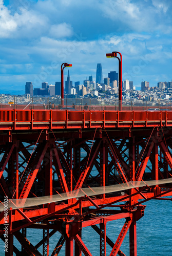 Картината върху платно Colorful red Bridge deck of world famous Golden Gate Bridge with 6 lane “Highway 1“ and “US 101“ from view point ”Battery Spencer“ on a clear sunny spring afternoon