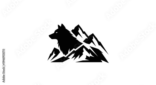 Wolf silhouette above rocky mountain peaks