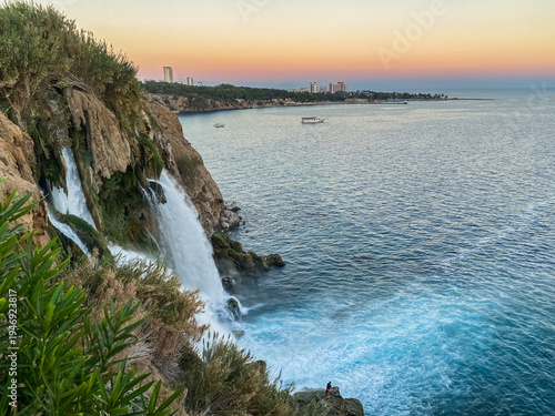 Wallpaper Mural A view of the Duden Waterfall at sunset, flowing into the sea in Antalya, Türkiye. Torontodigital.ca
