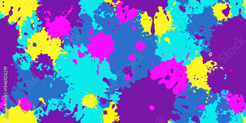 Vibrant abstract splashes of pink yellow and turquoise paint on purple