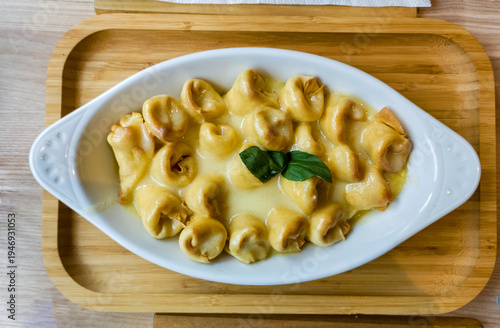 Small folded pancakes in sauce