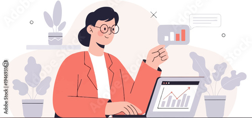 A woman in glasses and a blazer works at a laptop with charts and plants around her