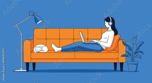 A woman wearing headphones relaxing on an orange sofa with a laptop while her cat sleeps peacefully beside her at home.