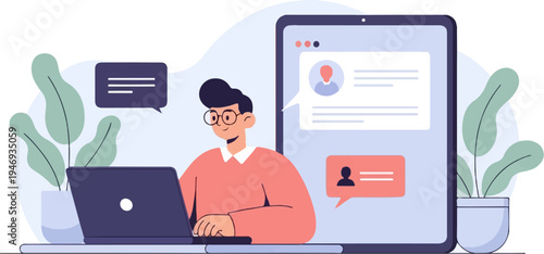 A person with glasses smiles while typing on a laptop, near a large tablet displaying a profile