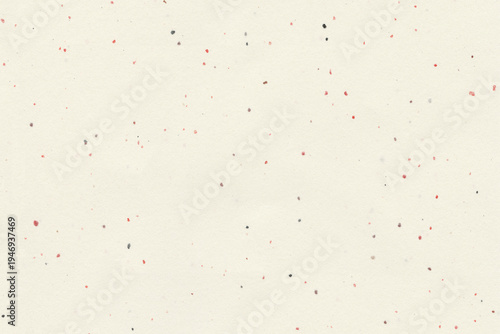 Fotografija Light beige paper sheet with subtle red and black speckles