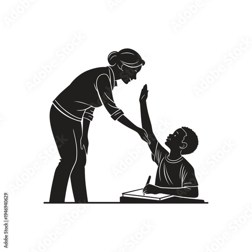 Teacher and student sharing a celebratory high five while the student sits at a desk with a book