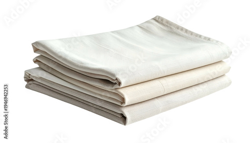 Stack of three folded light-colored linens, possibly towels or napkins, with texture visible