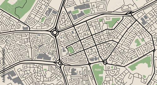 An overhead view of a detailed urban map showing roads, roundabouts, buildings, and green spaces in a city layout.