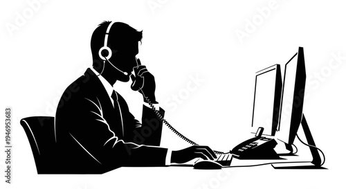 Silhouette of a businessman in a suit with headset on, working at a computer in an office