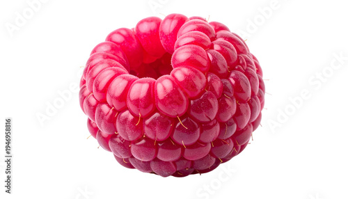 Close-up of a perfectly round, vibrant red berry with a hollow center against black