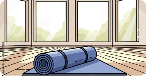 A blue yoga mat partially unrolled on a wooden floor in a room with large windows showing greenery