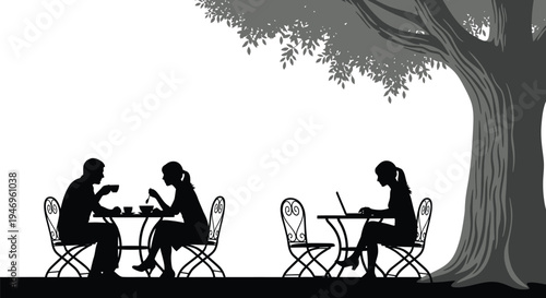 Silhouettes of couples dining and a woman working on a laptop sit beneath a large, textured tree canopy outdoors.