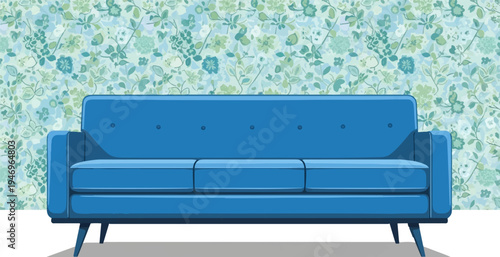 A blue three-seater sofa with tufted backrest against a light blue floral patterned wallpaper