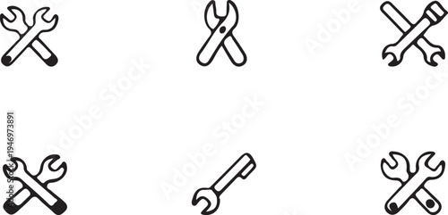 A set of five black and white wrenches on a plain white background for repair and maintenance themes