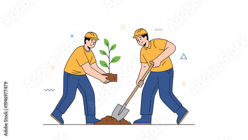 Two male workers wearing safety helmets and uniforms work together to plant a young green tree into the ground with a shovel.