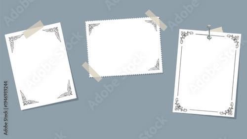 Trio of blank vintage-style notes or photo frames, some with decorative borders, secured with tape and a pin on a subtle grey background.