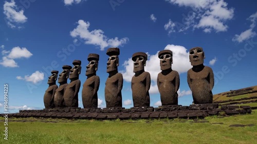 Moai statues of Ahu Tongariki on Easter Island under a blue sky
