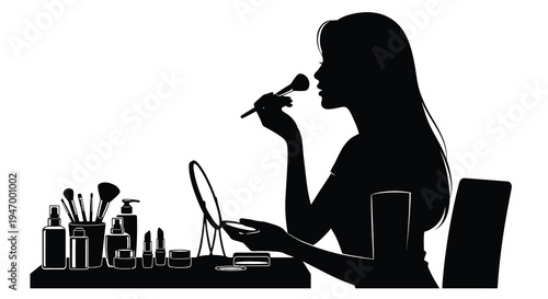 Woman applying makeup at a vanity striking black silhouette